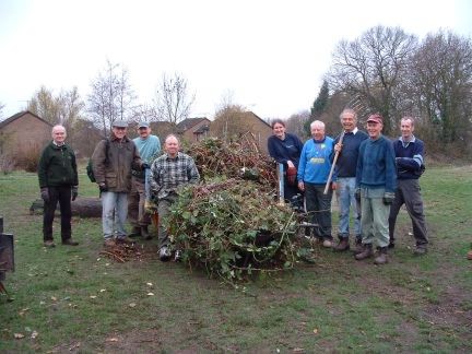 Blackwater Valley volunteers and one of the two skips of rubbish cleared from Brickfields Country Park