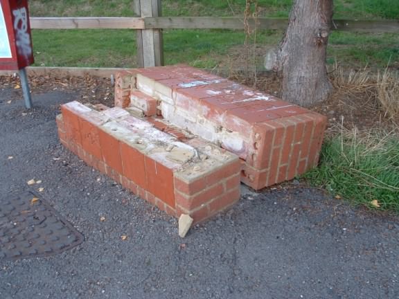 Brick plaque vandalised